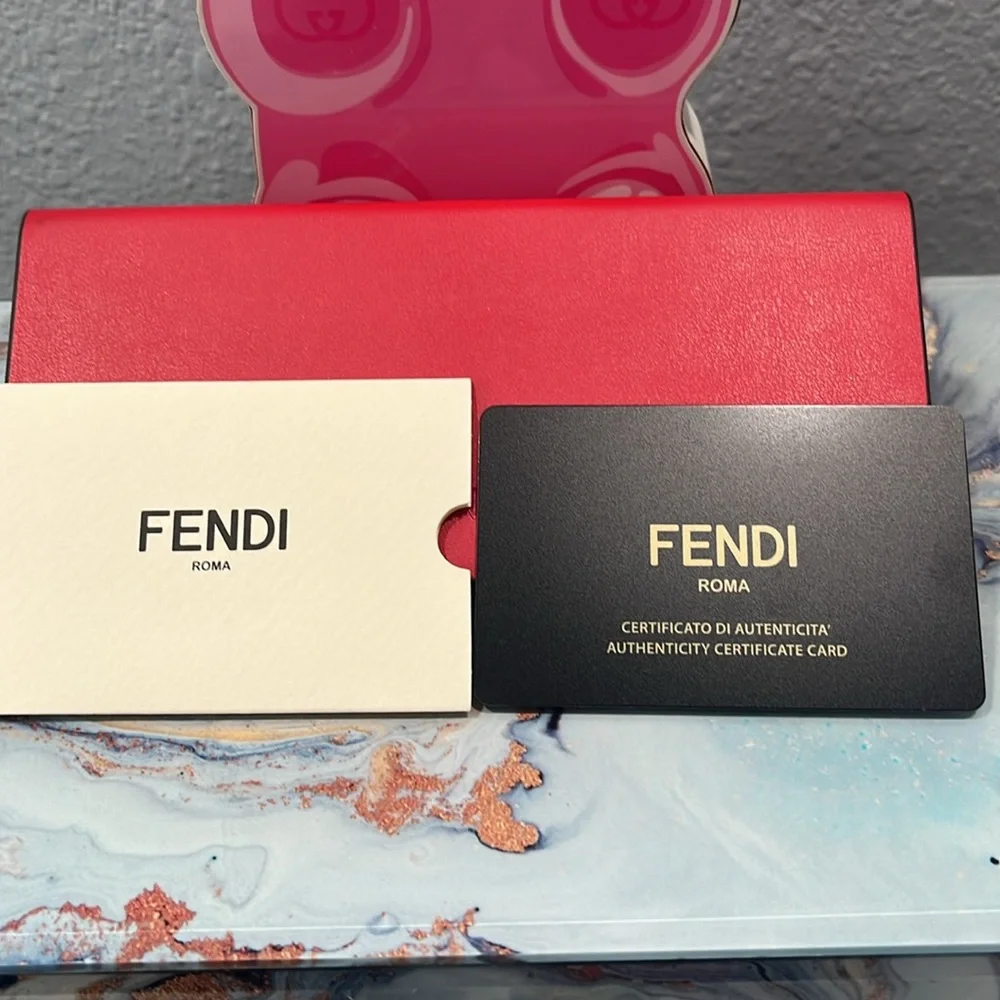 Fendi sunglasses with case, cleaning cloth, and authentication card